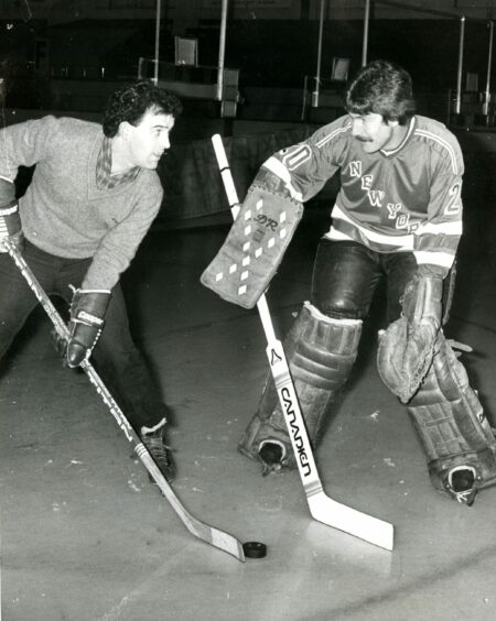 Dundee United goalkeeper Hamish McAlpine became a Rockets fan and he is pictured being put through his paces on the ice by Rockets goal-tender Mike Ward in January 1982