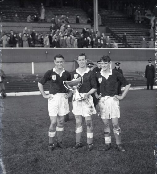 Frew, Boyd and Ziesing posing with the League Cup.