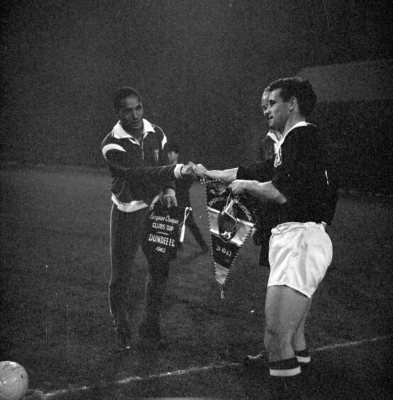 Dundee skipper Bobby Cox and Hilário exchanging pennants before the match got under way. Image: DC Thomson.