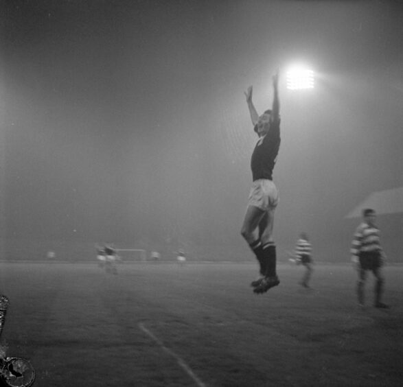 A hat-trick high jump by Alan Gilzean after his third goal in the European Cup tie. Image: DC Thomson.