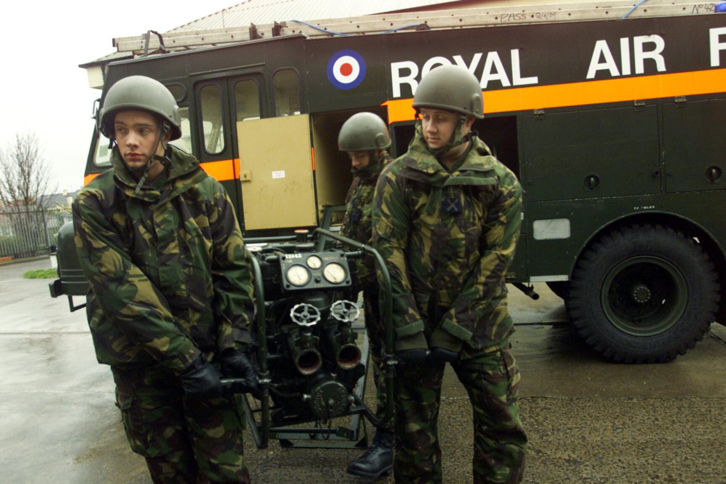 RAF personnel from Leuchars manning the pumps of the Arbroath Green Goddess in 2002.