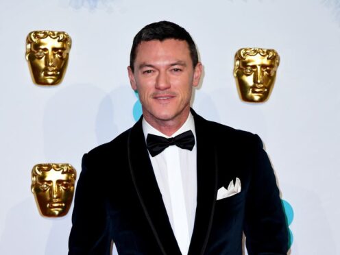 Luke Evans said he has always been happy with who he is – but believes he would not have had a successful career if he had not been allowed to play heterosexual roles (PA)
