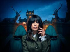 Claudia Winkleman who is flanked by two mysterious hooded figures in a first glimpse at the BBC’s new competition series, The Traitors (BBC/PA)