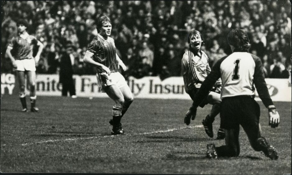 Agony and ecstasy as Sturrock rejoices at United's third goal against Rangers. Image: DC Thomson.