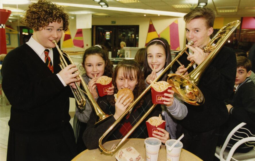 St Saviours Wind Orchestra call the tune in 1992 after winning a free meal as part of their prize for their success in the McDonald's Children of Achievement Music in the Community competition.