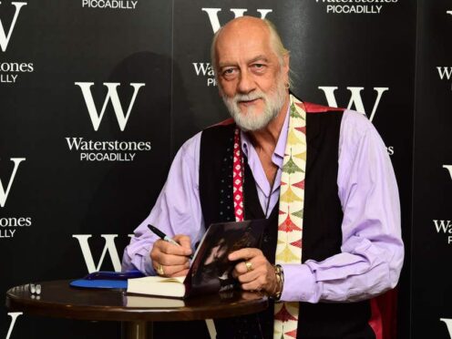 Mick Fleetwood signs copies of his new autobiography Play On at Waterstone’s in central London (Ian West/PA)