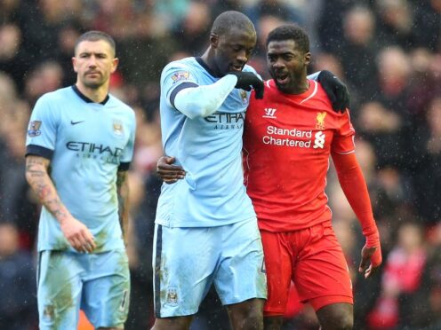 Kolo Toure (right) and brother Yaya (left) during their playing days at Liverpool and Manchester City respectively (Lynne Cameron/PA).