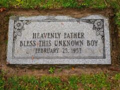 The marker of the grave of a small boy whose battered body body was found abandoned in a cardboard box 66 years ago (Matt Rourke/AP/PA)