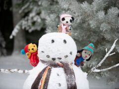 Sooty, Sweep and Soo with a snowman in the video for the Christmas single The Most Magical Time Of The Year (Sooty/Childline/PA)