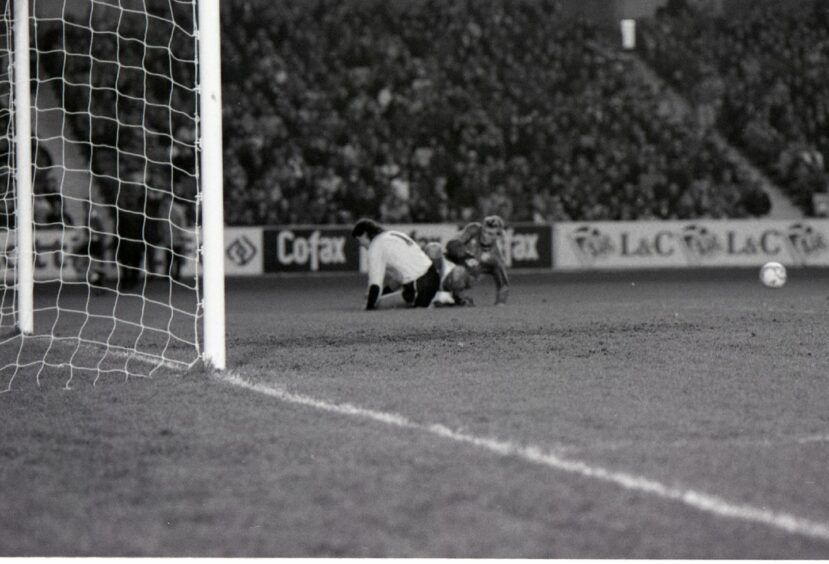 Tom Carson was injured following a first-half save from Robert Fleck at Ibrox in 1987. Image: DC Thomson.