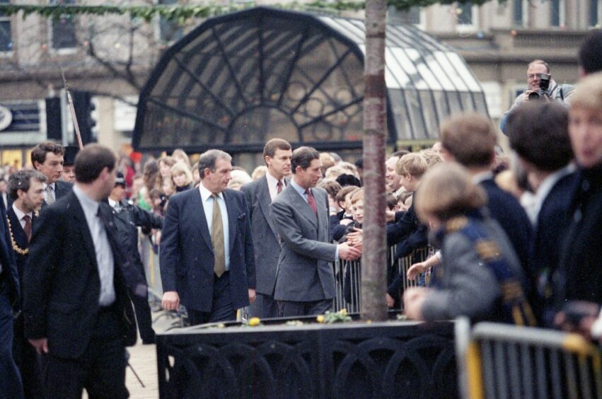 Charles speaking to the youngsters who gathered to meet him in Dundee City Square. Image: DC Thomson.