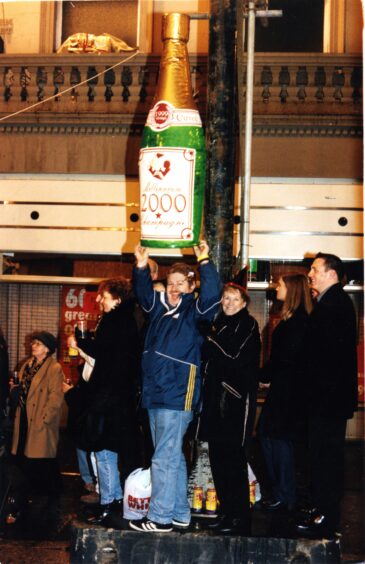 One reveller bringing a bottle to the City Square in 1999
