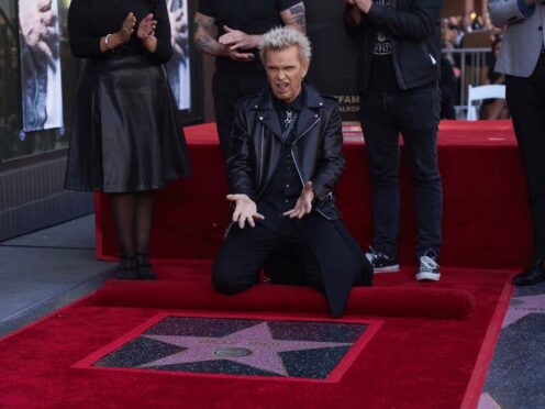 Billy Idol poses with his new star on the Hollywood Walk of Fame (Allison Dinner/AP)