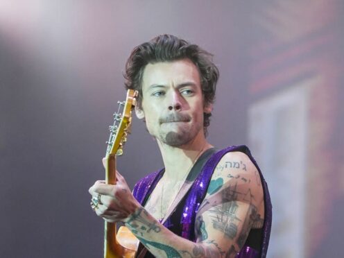Harry Styles apologises to LA audiences after ripping trousers onstage (PA)