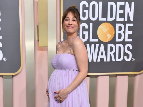 Kaley Cuoco debuts growing baby bump on Golden Globes red carpet (Jordan Strauss/AP)