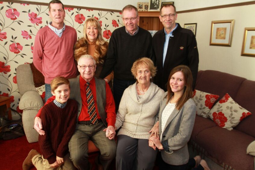 Jack and Martha on their diamond wedding anniversary with, front from left, grandson James, granddaughter Lauren and back, from left, David, Mandy, Geoff and John.