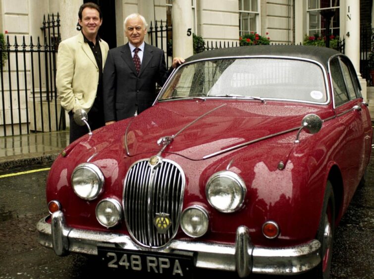 John Thaw and Kevin Whately with the Oxford detective's iconic red Jaguar Mark 2. Image: PA.