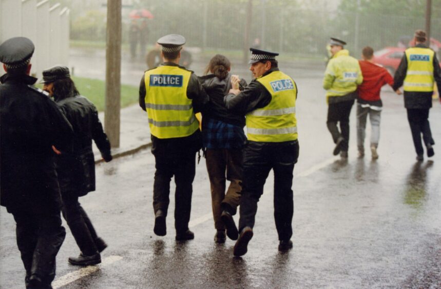 The police leading away some of the protesters. Image: DC Thomson.