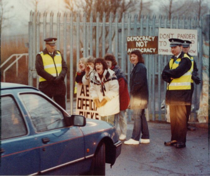 A group of women make their voices heard at the factory gates in 1993. Image: DC Thomson.