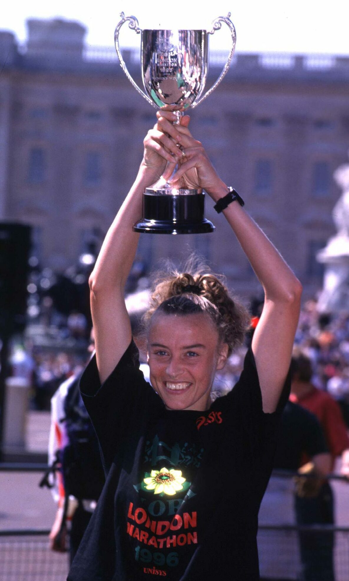 To the victor, the spoils: Liz hoists the trophy aloft after winning in London in 1996. Image: Shutterstock.