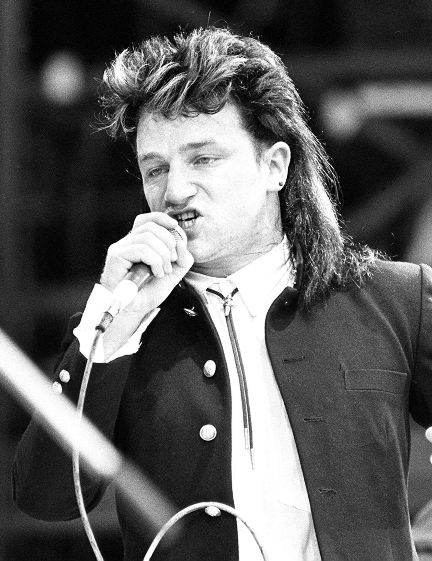 Bono sings as U2 perform at the Live Aid concert at WEmbley in July 1985