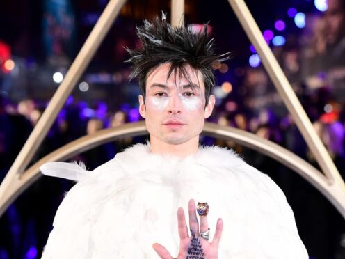 Ezra Miller teams up with two Batmans in The Flash Super Bowl trailer (Ian West/PA)