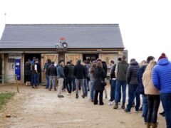 Customers queue to get into Jeremy Clarkson’s Diddly Squat Farm Shop near Chadlington in Oxfordshire during the opening weekend of the shop following its winter closure (Gareth Fuller/PA)