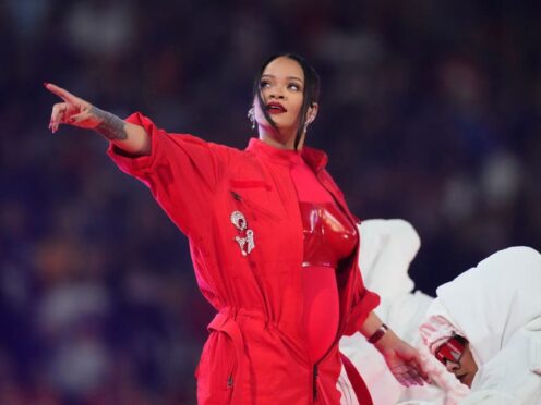 Rihanna appears to reveal pregnancy in guest-free Super Bowl halftime show (Ross D Franklin/AP)