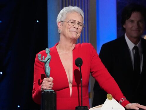Jamie Lee Curtis accepts the award for outstanding performance by a female actor at the SAG awards (Chris Pizzello/AP)