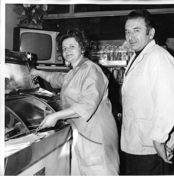 Matilde and Peter Dora at the family's chippie in 1970. Image: DC Thomson.