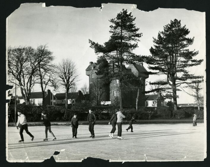 Children skating on ice at Claypotts Pond in Broughty Ferry during the Big Freeze.
