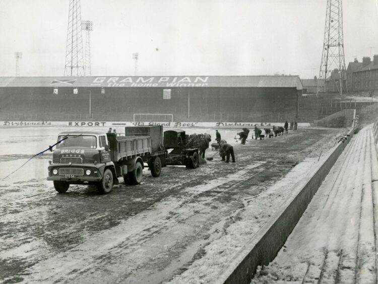 Tannadice Park workers clearing the ice and snow during the Big Freeze. 
