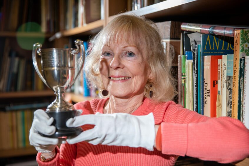 Wilma Lambie got up close and personal with the trophy after 60 years. Image: Kim Cessford/DC Thomson.