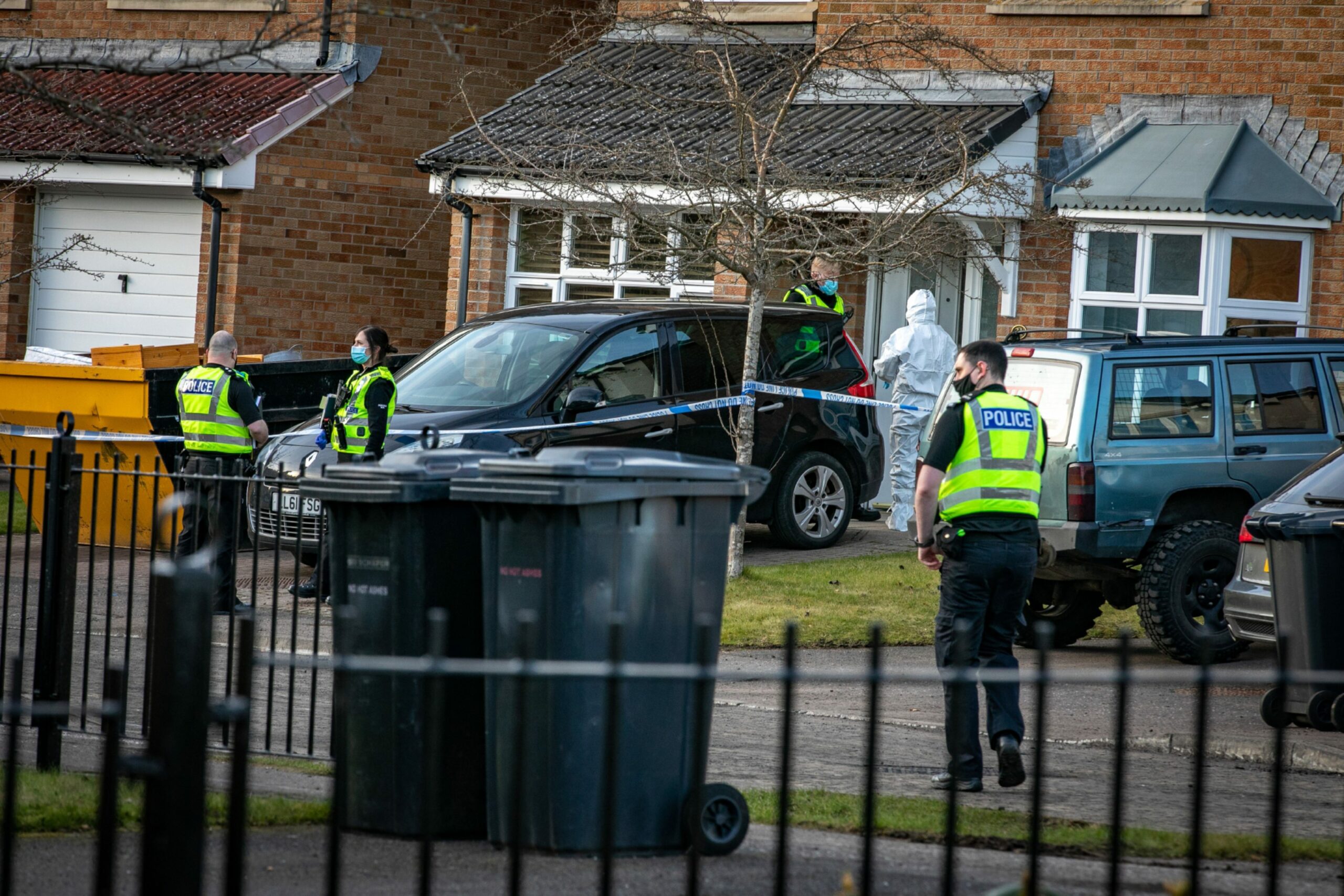 Forensic officers outside Innis's home in Troon Avenue, Dundee
