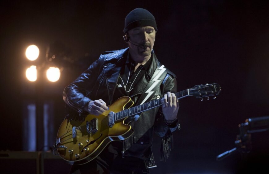 The Edge playing with U2 in Vancouver, Canada in May 2015. Image: Shutterstock.