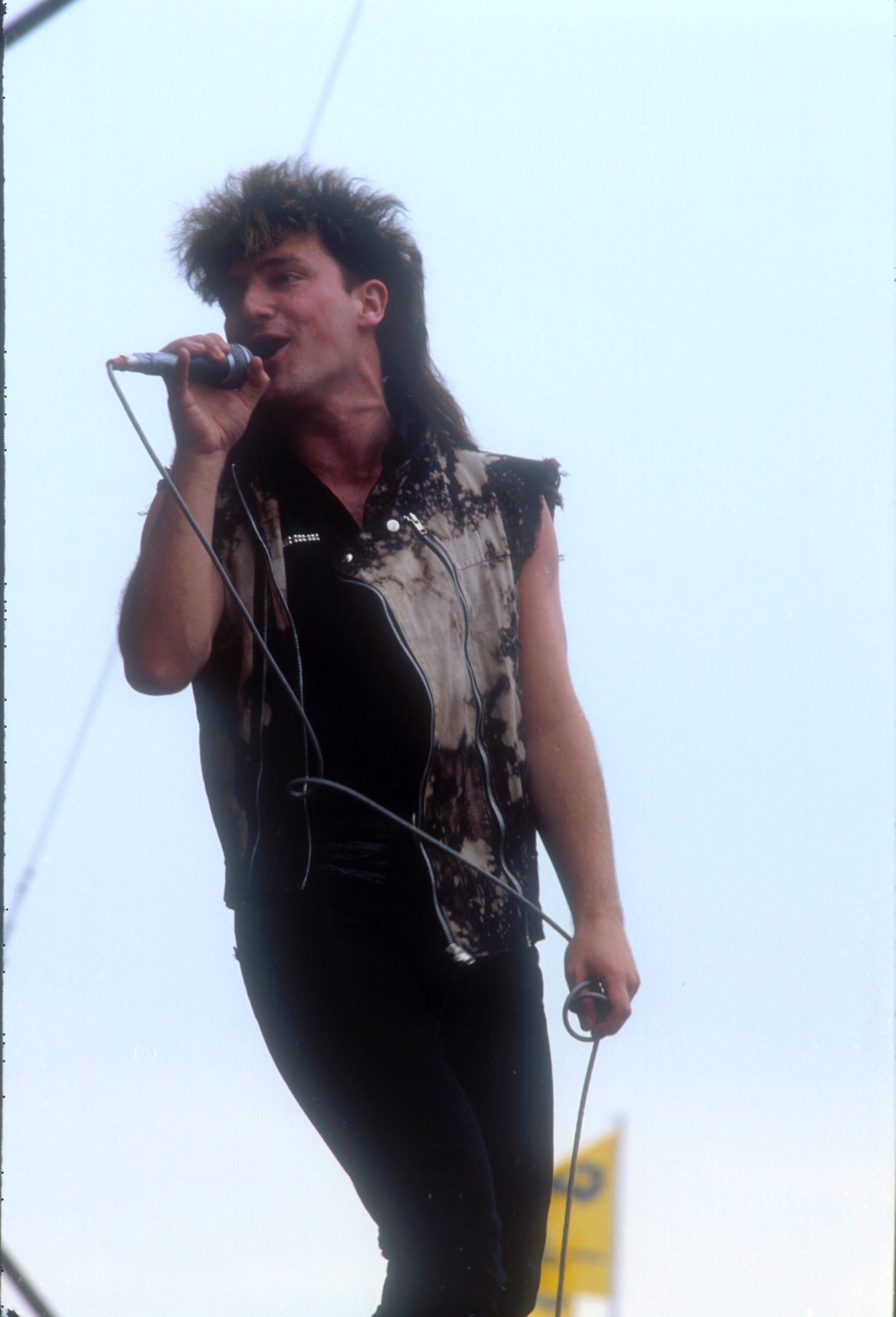Bono, at this point, has his feet firmly on the ground as U2 performi at the Torhout Werchter Festival in 1983. Image: Shutterstock.