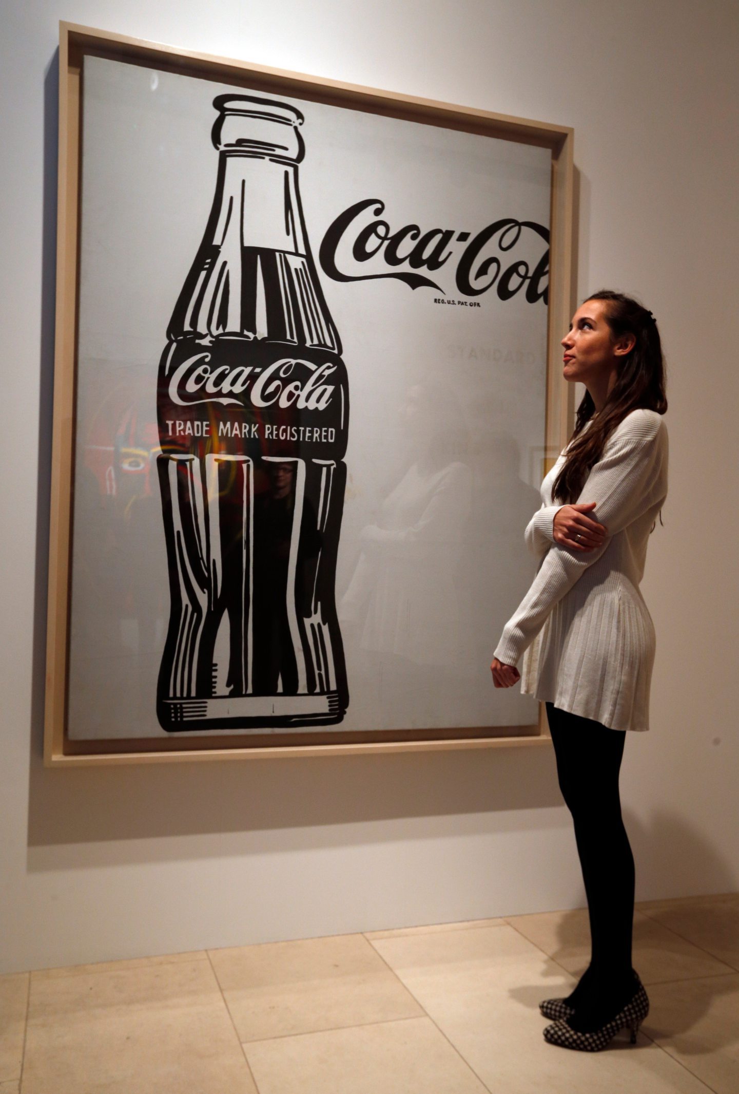 A 1962 Andy Warhol screenprint depicting a huge Coca-Cola bottle. Image: Lefteris Pitarakis/AP/Shutterstock.