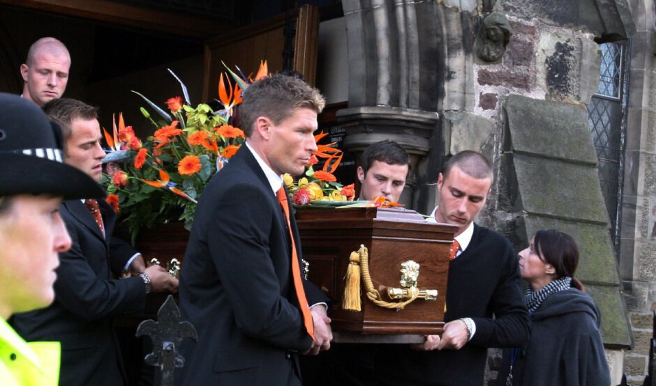 The players carried Thompson's coffin from the church after the service. Image: DC Thomson.