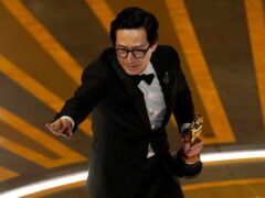 Ke Huy Quan accepts the award for best performance by an actor in a supporting role (Chris Pizzello/AP)