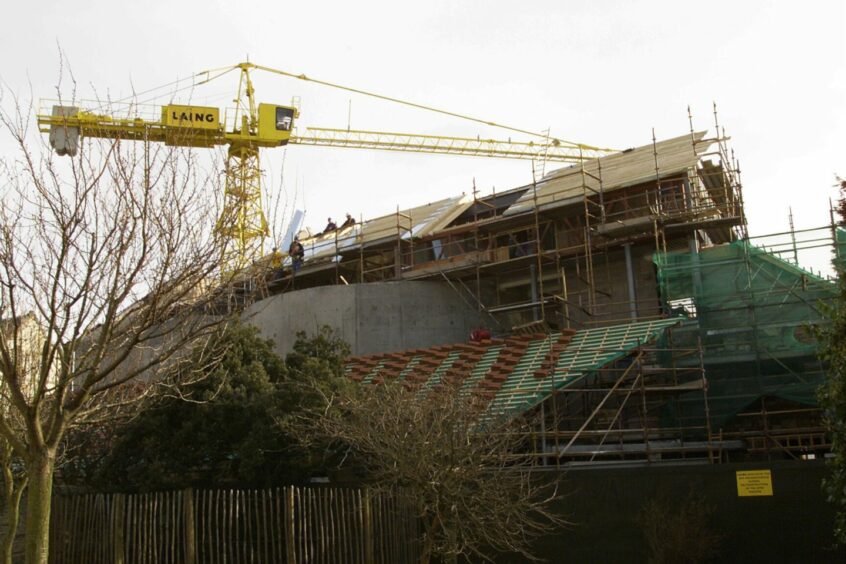 Builders at work on the Byre Theatre in St Andrews, before it opened in 2001. Image: DC Thomson.