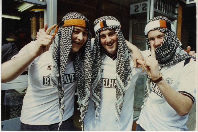 Dundee United fans in Arab headdress leave for Hampden to watch the 1991 Scottish Cup final. Image: DC Thomson.