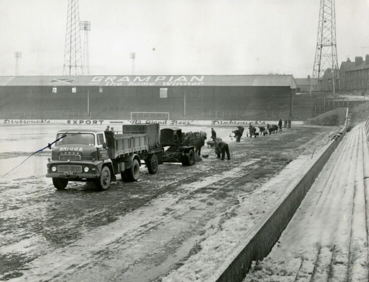 The Tannadice pitch being melted in an effort to play the Scottish Cup tie in 1963. Image: DC Thomson.