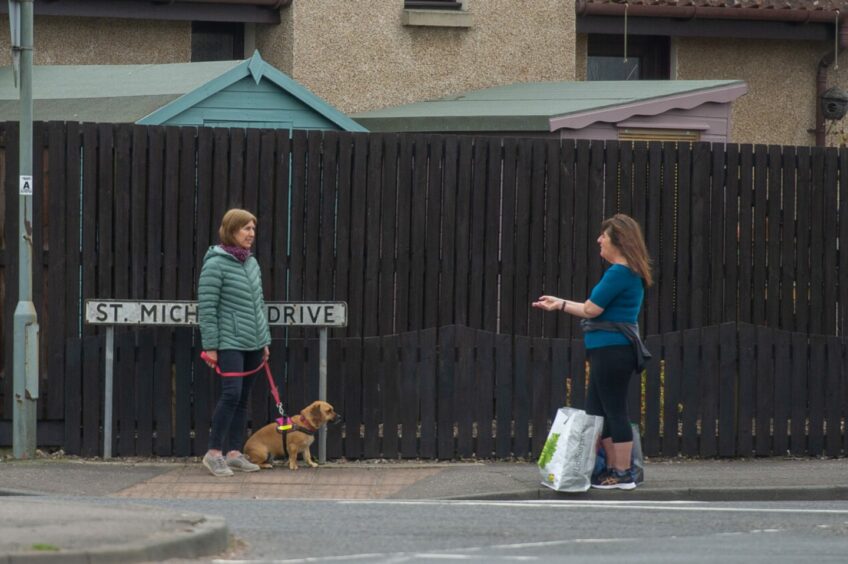 Chatting while keeping a safe distance at St Michael's Drive in Cupar. Image: Kim Cessford/DC Thomson.