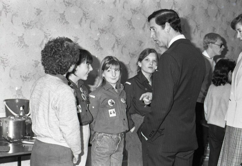 The prince chats with young members of Dundee Woodcraft Folk during his tour. Image: DC Thomson.