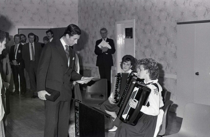 Charles was in tune with the girls from the Muirhead Accordion Band. Image: DC Thomson.