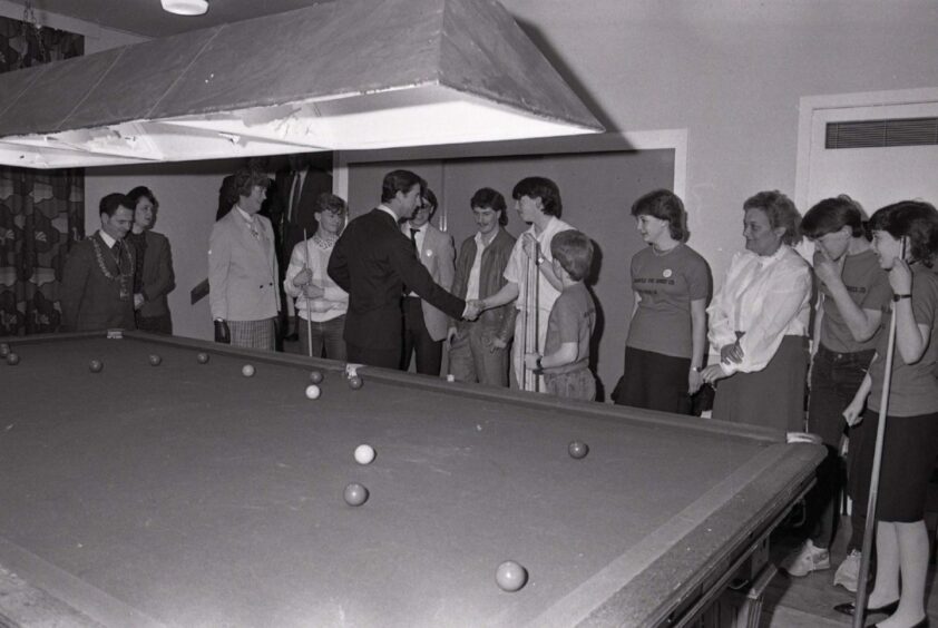 Charles was ready to take up the challenge of a game of snooker in Menzieshill. Image: DC Thomson.