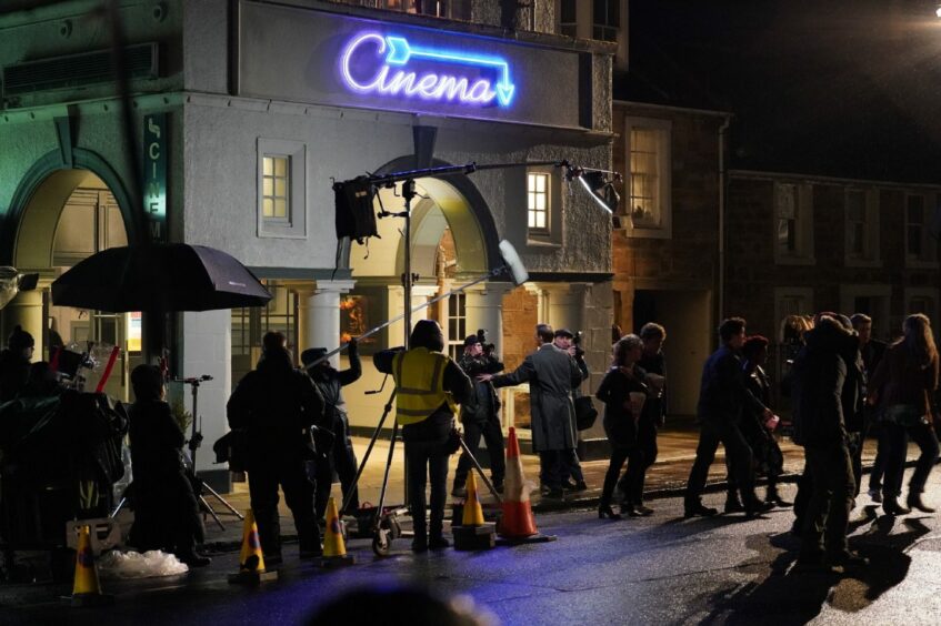 The Crown crew filming scenes outside the cinema in St Andrews.