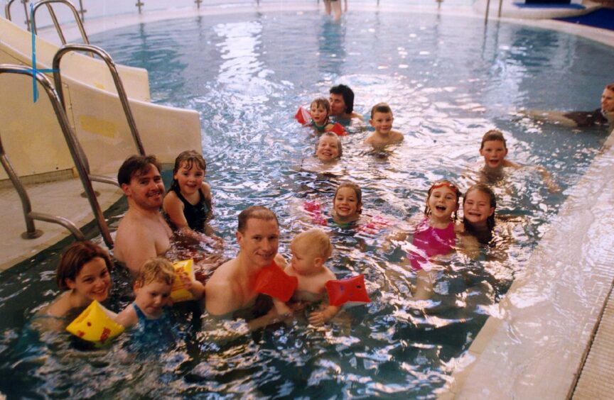 Swimmers enjoying a festive dook at the pool in 1999. Image: DC Thomson.