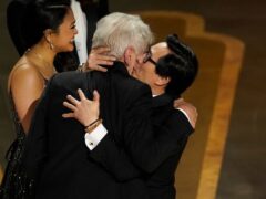 Harrison Ford, left, and Ke Huy Quan celebrate on stage at the Oscars (Chris Pizzello/AP)