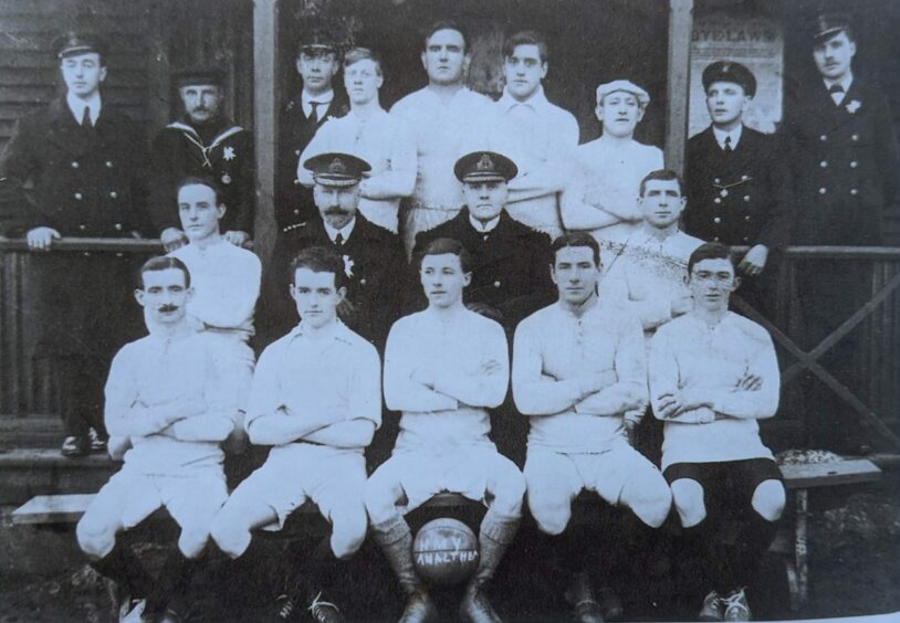 Ramsay is second from left in the back row in this line-up of the HMY Amalthaea football team. Image: Supplied.